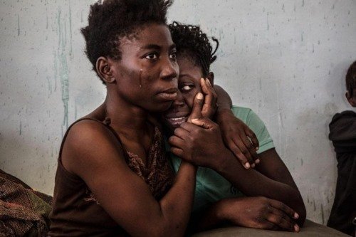 xTwo-Nigerian-refugees-cry-and-embrace-in-a-detention-centre-in-Surman-Libya-in-August-2016-Reuters-720x480.jpg.pagespeed.ic.yi-Ul7pM5c
